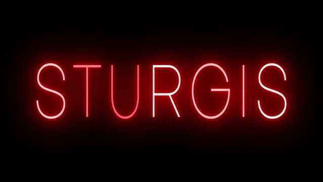 Flickering red retro style neon sign glowing against a black background for STURGIS