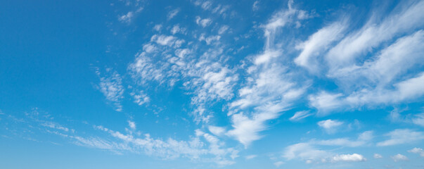 Spring blue sky cloud gradient background. Cloudy sky. Vivid cyan blue landscape in environment day horizon skyline view. White clouds on soft sky background. White cloudy sky.
