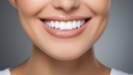 Obraz premium beautiful woman with beautiful smile on grey background. - Teeth whitening.