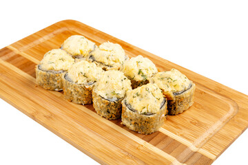 Japanese sushi roll fried on a wooden board, isolated.