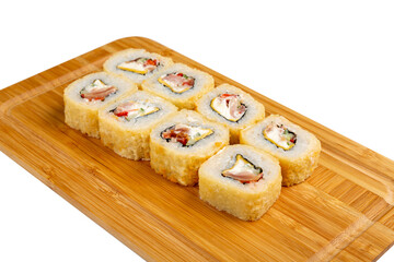 Japanese sushi roll fried with processed cheese, ham and tomato on a wooden board, isolated.