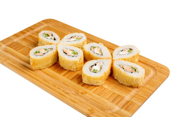 Japanese sushi roll fried with salmon and green onions on a wooden board, isolated.