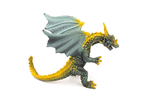 Plastic dragon toy on white background. The Simbol of new year 2024.