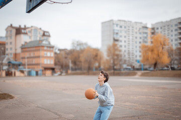 One young person playing basketball