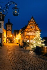Popular house in Germany, blue hour, lights on, picturesque street
