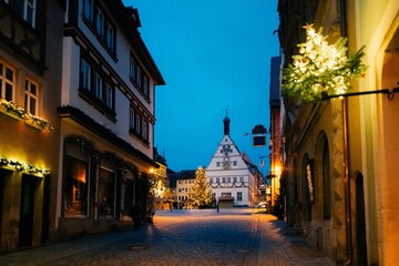 Fototapeta na wymiar Beautiful street in Germany, blue hour, lights are on