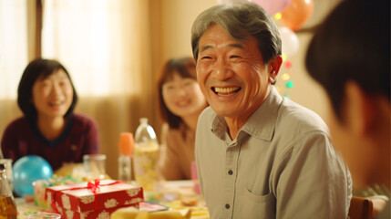 シニアと笑顔、お祝いのプレゼントに喜ぶ日本人男性