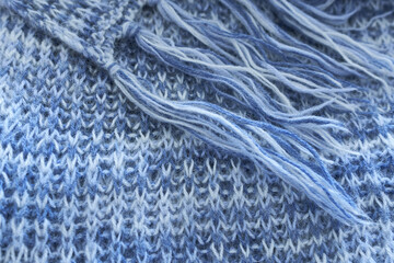 Close-up of knitted wool texture. Knitted wool background. Wool texture. Knitted scarf. 