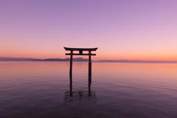 Gordijnen Beautiful dusk of a grand torii gate at Lake Biwa (Biwako), Takashima, Shiga, Japan. Silhouette. Copy space © MeiYi