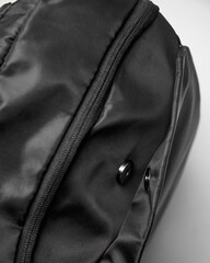 clip closure and zipper closure on the black backpack