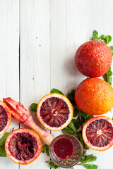 Blood Oranges and Fresh Mint on Wooden Surface - 722809250