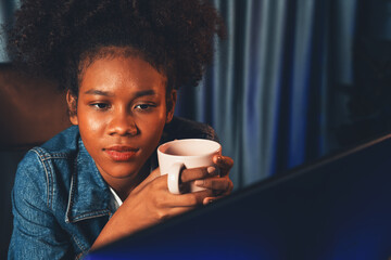 Young African American creator woman with serious face, thinking carefully and looking at final...
