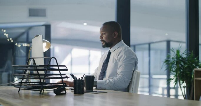 Business, black man and computer at desk in office arrival, work on email or corporate project at night. Table, professional and consultant on technology for deadline, information or online planning
