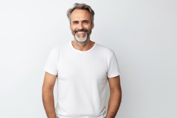 Portrait of handsome mature man in white t-shirt. Studio shot.