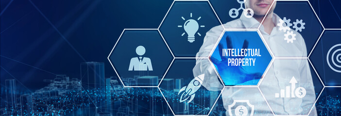 Business, technology, internet and network concept. Virtual screen of the future and sees the inscription: Intellectual property.