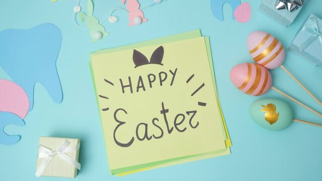 Dental layout with teeth figurines and postcard with Happy Easter text.