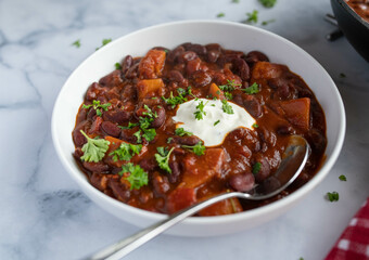 Healthy food for dinner or lunch with kidney bean stew with butternut pumpkin on a plate