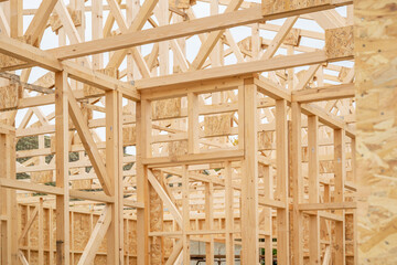 Prefabricated wooden house construction site, wood beam joists and wood chip boards - obrazy, fototapety, plakaty