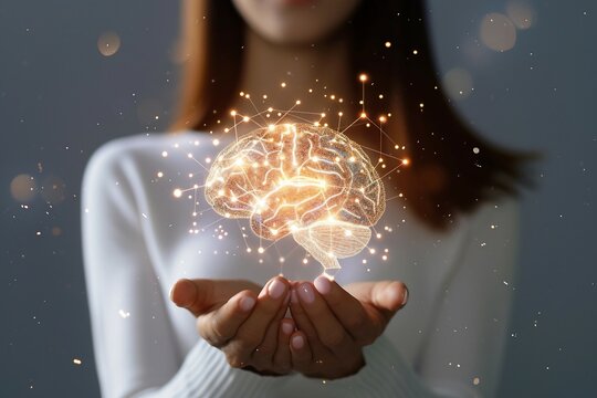 Woman Holding Brain Symbol in Hand. Neuroscience and Intelligence Concept