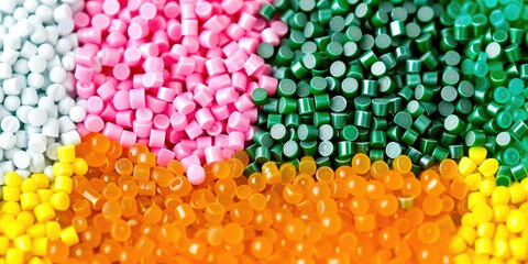 3d colorful tiny plastic cylindrical grains ,colorful plastic polymer pellets,polymer for pipes, Plastic and polymer industry,white pink orange green yellow PVC granulate.Microplastic products.