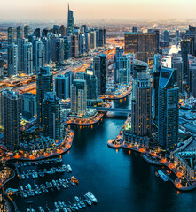 Modern achitecture of a big city. Fantastic rooftop view of Dubai Marina, United Arab Emirates. Nighttime skyline.