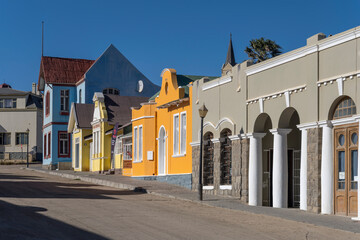 uphill street with picturesque old colorful buildings at historical town, Luderitz,  Namibia