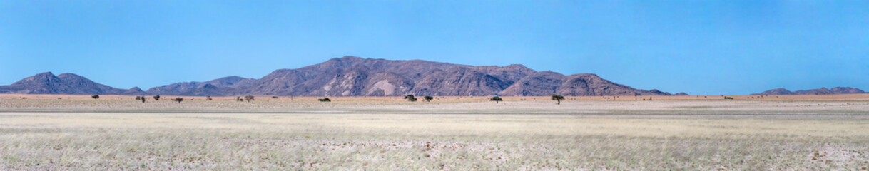 rocky hills and colorful flatland in Naukluft desert, near Garub,  Namibia