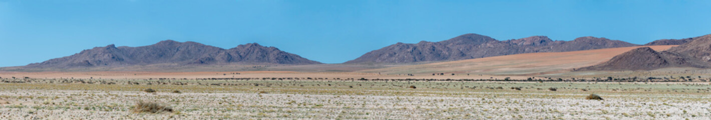rocky hills and colorful sand slopes in Naukluft desert, near Garub,  Namibia