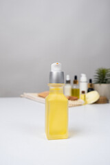Oils in cosmetology, oil in a glass jar with a dispenser for the care of the skin of the face, body and hair