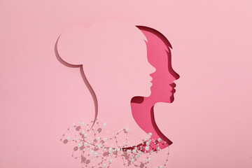 Paper female head on a light background