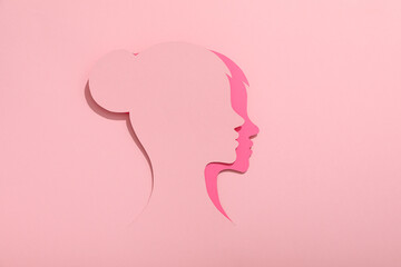 Paper female head on a light background