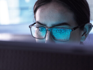 IT professional examining binary codes of computer virus