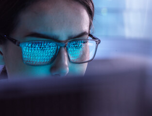 Young IT professional examining virus attacking computer