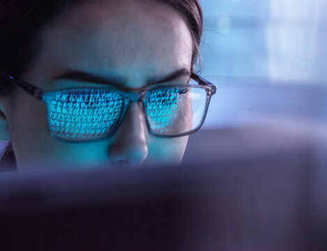 Young IT professional examining virus attacking computer