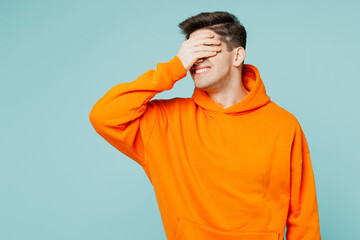 Young man he wearing orange hoody casual clothes put hand on face facepalm epic fail mistaken omg...