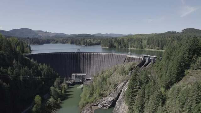 Ungraded 4k trucking aerial drone footage of a hydroelectric dam at Alder Lake in Washington State.