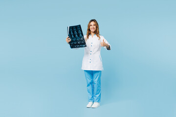 Full body doctor woman wears gown suit work in hospital clinic office hold x-ray brain by...