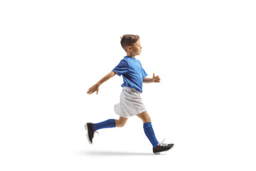 Fototapeta na wymiar Boy in a blue and white football kit running fast