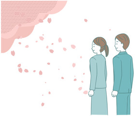 桜の下のスーツ姿の男性と女性