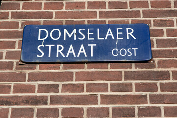 Fototapeta na wymiar Close Up Street Sign Domselaerstraat At Amsterdam The Netherlands 26-1-2023