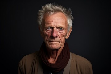 Portrait of an elderly man with a sad expression on his face.