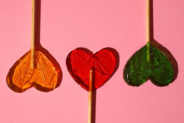 Sweets concept, heart shaped lollipops close up
