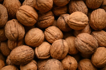 Top view of whole walnuts as background texture