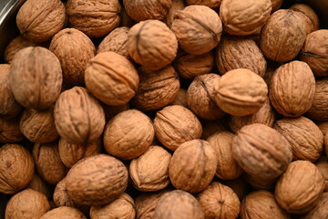 Top view of whole walnuts as background texture