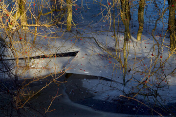 Breakup in the ice in sunshine nearby the lake