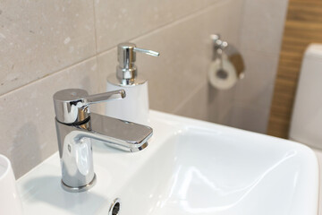 close-up of washbasin faucet