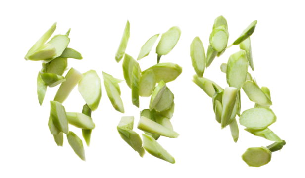 Chopped Kale fly in mid air, green fresh vegetable chinese kale falling. Organic fresh vegetable with eaten leaf of chinese kale, heap close up texture. White background isolated freeze motion