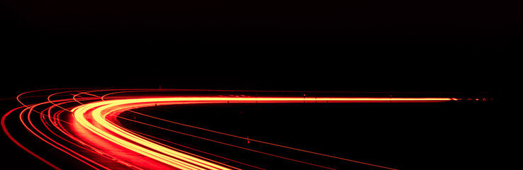 red car lights at night. long exposure