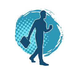 Silhouette of a business man carrying a briefcase