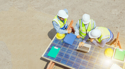 Top view team male engineers discuss energy engineering business issues on solar panels save money by using solar energy solar cell installation services in industrial plants clean energy sustainable.